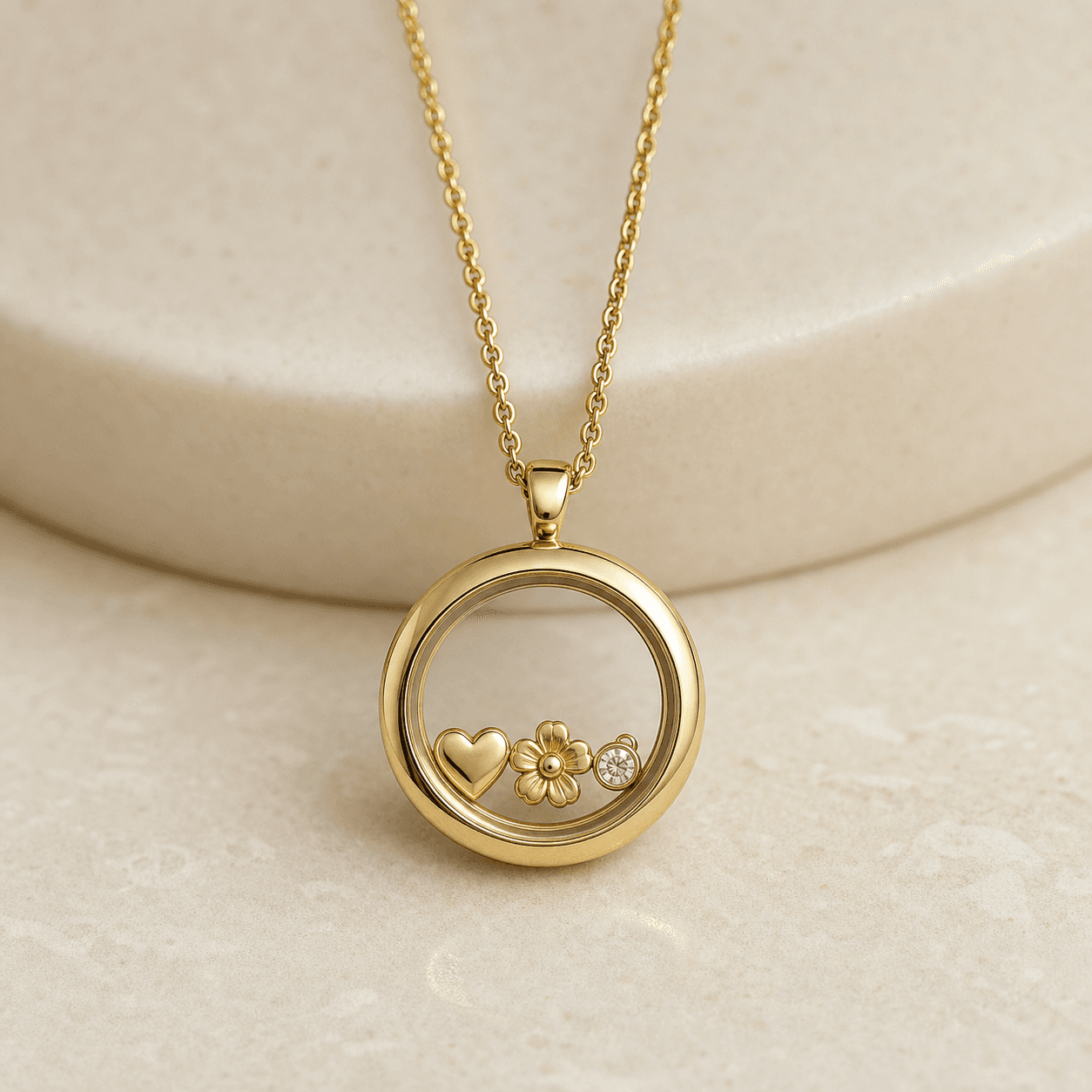 Gold round living locket with heart, flower, and crystal charms